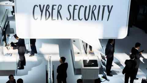 A sign reads 'cyber security' at the Huawei booth at the CeBIT computer show in Hannover, Germany, Wednesday March 16, 2016. The computer show runs until 18 March 2016. (Ole Spata/dpa via AP)