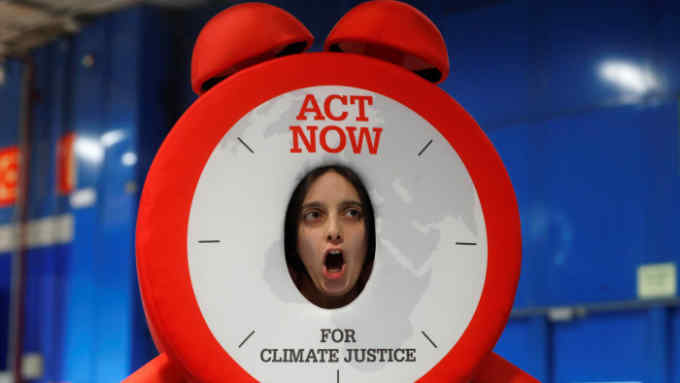 Mandatory Credit: Photo by CHEMA MOYA/EPA-EFE/Shutterstock (10493201i) An activist takes part in a protest action, organized by the ACT Now for Climate Justice group, held in the framework of the fifth day of the UN Climate Change Conference COP25 in Madrid, Spain, 06 December 2019. The Conference runs from 02 to 13 December 2019 in the Spanish capital. UN Climate Change Conference COP25, Madrid, Spain - 06 Dec 2019