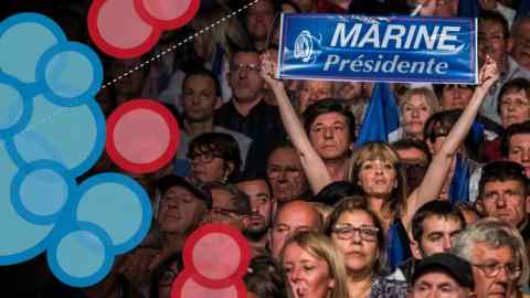 Supporters listen to Marine le Pen at a National Front rally in Marseille
