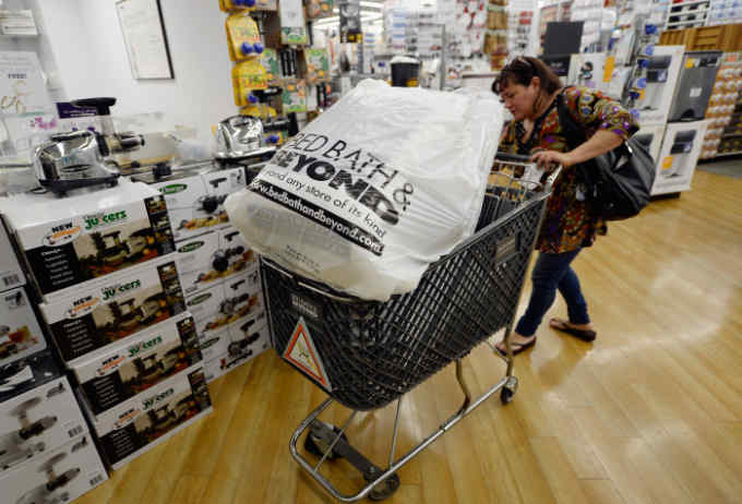 LOS ANGELES, CA - APRIL 10:  Customers carry bags from  Bed Bath & Beyond store on April 10, 2013 in Los Angeles, California. The home goods retailer is expected to release fourth-quarter earnings figures after the closing bell.  (Photo by Kevork Djansezian/Getty Images)
