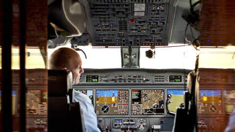 Pilot Marc Lajuenesse waits for take off in the cockpit of a Gulfstream jet during a demonstration of a prototype infrared technology developed by Honeywell, Tuesday, December 14, 2010. An infrared camera sensor mounted on the underside of the aircraft's nose cone feeds real-time data to 3-D graphical displays on the cockpit instrument panel, allowing pilots to better &quot;see&quot; their environment at night or in low visibility situations. Photographer: Emile Wamsteker/Bloomberg News