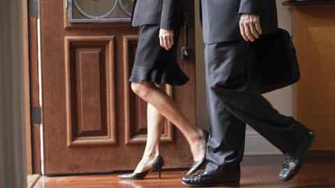Low section of business man and woman exiting through doorwayhttp://i449.photobucket.com/albums/qq220/iphotoinc/MenBanner1.jpg