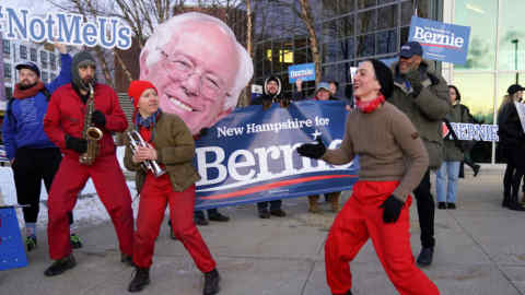 Supporters of Democratic candidate Bernie Sanders dance and play music outside the McIntrye-Shaheen 100 Club Dinner in Manchester, New Hampshire, U.S., February 8, 2020. REUTERS/Kevin Lamarque