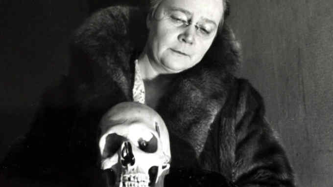 Literature Personalities, pic: 1939, Miss Dorothy L, Sayers, (1893-1957) the English detective story writer pictured at the Detection Club, London, with &quot;Eric&quot; the only all electric skull and club mascot  (Photo by Popperfoto/Getty Images)