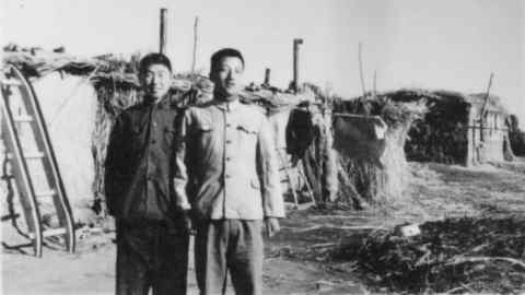 Weijian Shan with Li Baoquan (right) in front of self-built makeshift reed-and-mud hut in Xiao Ming Sha by Lake Wuliangsu during reed-cutting season (December 1970 to February 1971). From his book Out of the Gobi . FOR REVIEW