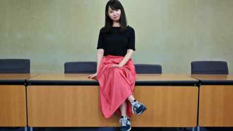 Yumi Ishikawa, leader and founder of the KuToo movement, poses after a press conference in Tokyo on June 3, 2019. - A group of Japanese women on June 3 submitted a petition to the government to protest what they say is a de-facto requirement for female staff to wear high heels at work. The online campaign #KuToo, using a pun from a Japanese word &quot;kutsu&quot; -- that can mean either &quot;shoes&quot; or &quot;pain&quot; -- was launched by actress and freelance writer Yumi Ishikawa and quickly won support from nearly 19,000 people online. (Photo by Charly TRIBALLEAU / AFP) (Photo credit should read CHARLY TRIBALLEAU/AFP via Getty Images)