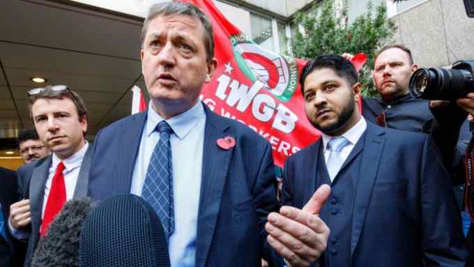 Former Uber drivers James Farrar (L) and Yaseen Aslam address the media as they leave the Employment Appeals Tribunal in central London on November 10, 2017. US ride-hailing app Uber on Friday lost a landmark case in Britain that would give drivers the right to paid holidays and the national minimum wage, lawyers representing the claimants said. Farrar, who brought the test case with fellow former driver Aslam, called Uber's business plan &quot;brutally exploitative&quot;. Uber said it will appeal the ruling. / AFP PHOTO / Tolga AKMENTOLGA AKMEN/AFP/Getty Images