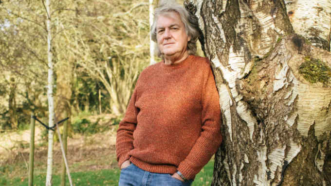 James May is an English television presenter and journalist. He is best known as a co-presenter of the motoring programme Top Gear alongside Jeremy Clarkson and Richard Hammond from 2003 until 2015. He is also a co-presenter in the television series The Grand Tour for Amazon Video, alongside his former Top Gear colleagues, Clarkson and Hammond. Here James May walks and poses in a small wood at the top of his garden in Southern England, UK.