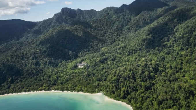 The Datai resort has a private footpath that leads to the white-sand beach