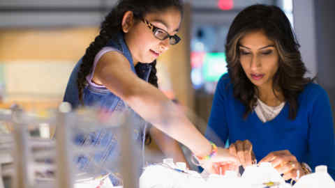 ENBBNB Mother daughter playing electricity exhibit at science center