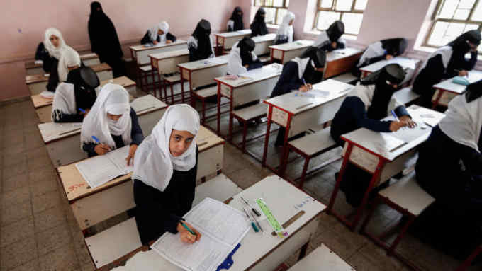 Female Yemeni students sit at a final exam in a secondary school in the capital Sanaa on July 8, 2017.