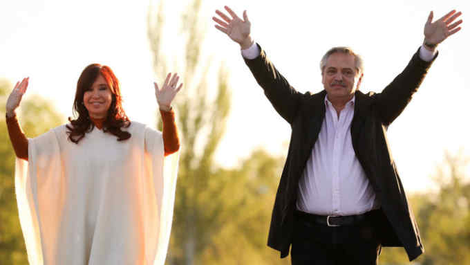 In this handout photo released by Argentine &quot;Frente de Todos&quot; opposition party of its presidential candidate Alberto Fernandez (R) and his running mate Former Argentine President, current senator and vice-presidential candidate Cristina Fernandez de Kirchner wave to supporters in Santa Rosa, La Pampa, some 600 Km southwest of Buenos Aires on October 17, 2019 in the 74th anniversary of Peron's Loyalty Day, during a political rally for the upcoming general elections to be held on October 27. - The Loyalty Day remembers October 17, 1945 labor demonstration that forced the military government to liberate coronel Peron who was imprisoned in Martin Garcia Island. (Photo by JOAQUIN SALGUERO / FRENTE DE TODOS PARTY / AFP) / RESTRICTED TO EDITORIAL USE - MANDATORY CREDIT &quot;AFP PHOTO /FRENTE DE TODOS PARTY / Joaquin SALGUERO &quot; - NO MARKETING - NO ADVERTISING CAMPAIGNS - DISTRIBUTED AS A SERVICE TO CLIENTS (Photo by JOAQUIN SALGUERO/FRENTE DE TODOS PARTY/AFP via Getty Images)