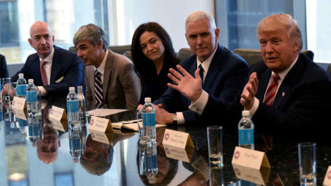 (L-R) Amazon's chief Jeff Bezos, Larry Page of Alphabet,  Facebook COO Sheryl Sandberg , Vice President elect Mike Pence and President-elect Donald Trump attend a meeting at Trump Tower December 14, 2016 in New York. / AFP / TIMOTHY A. CLARY        (Photo credit should read TIMOTHY A. CLARY/AFP/Getty Images)