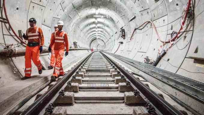LONDON, ENGLAND - SEPTEMBER 14: Crossrail engineers inspect the completed track as the Crossrail project celebrates the completion of the Elizabeth line track, on September 14, 2017 in London, England. (Photo by John Phillips/Getty Images)