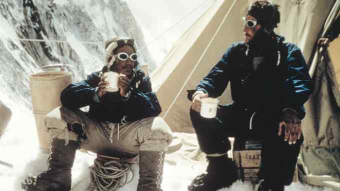 Tenzing Norgay and Edmund Hillary drinking tea after their successful ascent of Everest in 1953