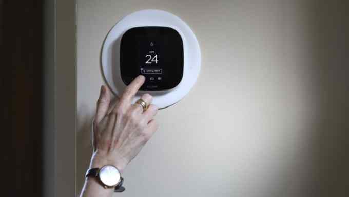 TORONTO, ON - AUGUST, 30 Diana Carradine with Ecobee smart thermostat in her home in the Eglinton and Avenue road area. The province is launching the Green Ontario Fund, bankrolled with $377 milion in cap-and-trade revenues, to help homeowners and businesses with programs to reduce their greenhouse gas emissions. The first move is offering free smart thermostats to eligible homeowners, so they can more easily turn down the heat or air conditioning when they're not âehome -- saving on natural gas and electricity. (Richard Lautens/Toronto Star via Getty Images)