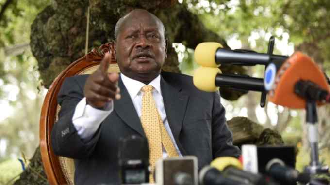 Newly re-elected president Yoweri Museveni, in power since three decades, gestures as he speaks during a press conference at his country house in Rwakitura, about 275 kilometres west of the capital Kampala on February 21, 2016. Uganda's veteran leader was declared the winner of the country's presidential election with 60 percent of the vote on February 20, far ahead of the 35 percent won by detained opposition chief Kizza Besigye, whose house was surrounded by police in riot gear as the results were announced. Uganda's presidential election was marred by chaos as the Electoral Commission failed to deliver the voting materials to most of the Kampala based polling stations. / AFP / Isaac Kasamani (Photo credit should read ISAAC KASAMANI/AFP/Getty Images)