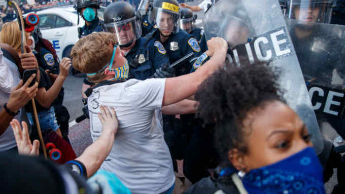 Mandatory Credit: Photo by SHAWN THEW/EPA-EFE/Shutterstock (10665132d) People, who gathered to protest the death of George Floyd, scuffle with Metropolitan Police District officers near the White House in Washington, DC, USA, 31 May 2020. A bystander's video posted online on 25 May, shows George Floyd, 46, pleading with arresting officers that he couldn't breathe as one officer knelt on his neck. The unarmed black man soon became unresponsive, and was later pronounced dead. According to news reports on 29 May, Derek Chauvin, the police officer in the center of the incident has been taken into custody and charged with murder in the George Floyd killing George Floyd protests in Washington, DC, USA - 31 May 2020
