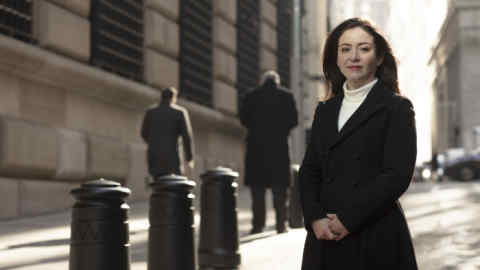 Lawyer and Writer Carmen Segarra photographed for the Financial Times in front of the Federal Reserve Building in New York