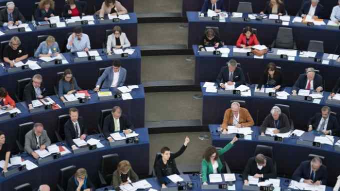 Ska Keller, co-lead candidate of the European Green Party (EGP), center, and other Members of European Parliament (MEP), raise their hands to vote at the European Parliament in Strasbourg, France, on Wednesday, April 17, 2019. Next month's European Parliament Elections, a twice-a-decade vote, is one of the biggest democratic exercises on Earth. Photographer: Jasper Juinen/Bloomberg