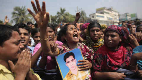 Protesters and relatives of the victims of the Rana Plaza disaster demand compensation