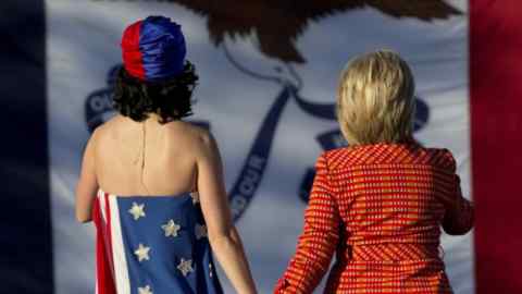 Pop singer Katy Perry and candidate Hillary Clinton on stage at the Jefferson-Jackson dinner in Iowa, October 2015