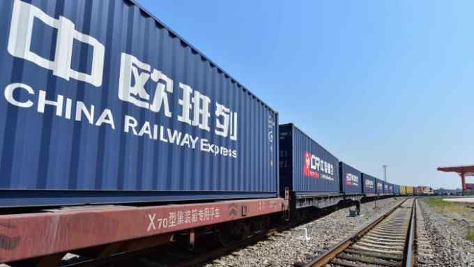 A freight train transporting containers laden with goods from London, arrives at Yiwu railway port station in Yiwu, east China's Zhejiang province on April 29, 2017. 
Laden with whisky and baby milk, the first freight train linking China directly to the UK arrived in the eastern Chinese city of Yiwu on April 29 after a 12,000-kilometre (7,500-mile) trip, becoming the world's second-longest rail route. / AFP PHOTO / STR / China OUTSTR/AFP/Getty Images
