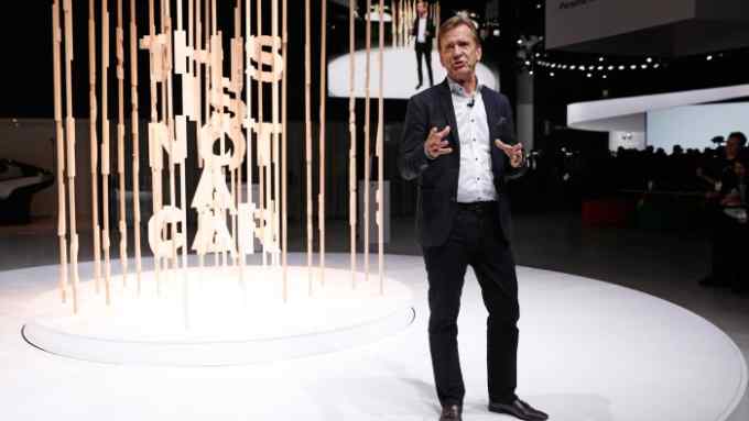 Hakan Samulesson, President and CEO, Volvo Car Group, speaks in front of a spinning art display made of wood spelling out &quot;This is not a car.&quot; during a Volvo press conference at the Los Angeles Auto Show in Los Angeles, California, U.S. November 28, 2018. REUTERS/Mike Blake - HP1EEBS1KHD86