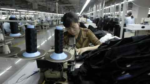CHINA GARMENTS EXPORT...epa00158272 Workers sew materials to make clothing at a factory of the Youngor Group Company, the largest garment enterprise in China, in Ningbo, Monday 22 March 2004. Last year Youngor exported to Japan, Europe and the United States over 400 million euros (four billion yuan) worth of garments and textiles. Garment quotas on Chinese imports by the United States are expected to continue for the remainder of the year, as the US International Trade Commission anticipates many American textile and garment importers will increasingly choose China as supplier. EPA/MICHAEL REYNOLDS