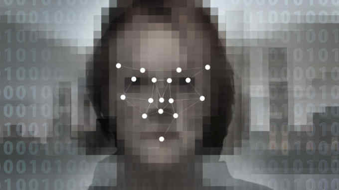 T9C81W Concept image of a digitised face overlaid with a biometric facial recognition pattern