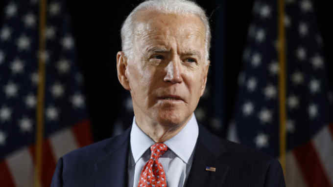 FILE - In this March 12, 2020, file photo Democratic presidential candidate former Vice President Joe Biden speaks about the coronavirus in Wilmington, Del. With the launch of his live-streamed web videos, weekly podcast and a new email newsletter, Joe Biden is building an online media presence since the coronavirus outbreak essentially froze traditional campaigning. (AP Photo/Matt Rourke, File)
