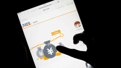 Images Of Online Investment Platforms Vying With Chinese State-Controlled Banks For Household Savings...The website for Yu'E Bao, an online financial product offered through Alibaba Group Holding Ltd.'s online payment affiliate Alipay.com Co., is displayed on an Apple Inc. iPad in an arranged photograph in Hong Kong, China, on Tuesday, April 22, 2014. As Internet financial products gather momentum, ChinaÕs state-controlled banks are losing share of the nationÕs 44.8 trillion yuan in household deposits, which for decades have helped keep their profits high as rates fixed by the government created a 3 percent spread between what they collect on loans and what they pay on one-year time deposits. Photographer: Brent Lewin/Bloomberg
