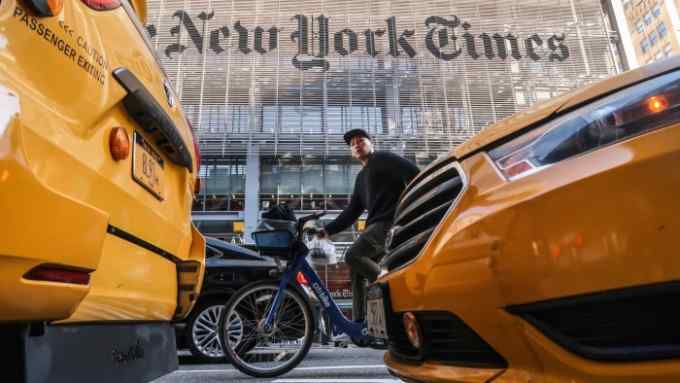 NEW YORK, NY - OCTOBER 23: A person rides past the front of the New York Times headquarters on October 23, 2018 in New York City. (Photo by Gary Hershorn/Getty Images)