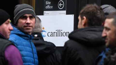 epa06440178 Carillion workers line up outside a sits office to check on the status of their jobs in London, Britain, 15 January 2018. Thousands of jobs in the UK and abroad may be lost following the news that Construction company Carillion is to go into liquidation. Talks between lenders and the British government have failed to reach a deal. EPA/ANDY RAIN