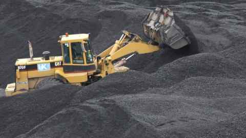 UK Coal Surface And Underground Mine...A Caterpillar Inc. bulldozer works on a pile of coal at the Thoresby colliery operated by U.K. Coal Plc., in Mansfield, U.K., on Wednesday, Aug 4, 2010. U.K. Coal Plc., is the country's biggest producer of the fuel. Photographer: Chris Ratcliffe/Bloomberg