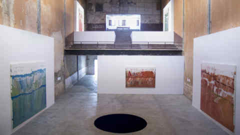 Exhibition view Galleria Continua, Habana: JOSE YAQUE Origin (Part I of the exhibition series 'The artworkthatinterests me') 2017  acrylicpaint, enamel on canvas ANISH KAPOOR Descentinto Limbo, Havana 2016 concrete, iron and pigment diameter 3 m Courtesy: the artist and GALLERIA CONTINUA, San Gimignano / Beijing / LesMoulins / Habana Photo by: Michel Pou