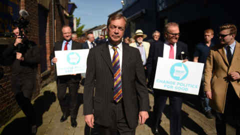 Brexit Party leader Nigel Farage (C) and other candidates including John Longworth (R) and Christopher Barker (L) visit Pontefract, northwest England, on May 13, 2019 campaigning for the European Parliament election. - The newly-formed Brexit Party, which wants a clean break from the EU, has doubled its lead over other British parties in an opinion poll out Sunday on the European Parliament elections. Despite voting in a referendum to leave the European Union in 2016 Britain is braced to take part in the European Parliament election on May 23. (Photo by Oli SCARFF / AFP)OLI SCARFF/AFP/Getty Images