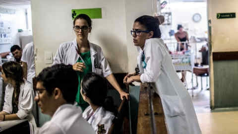 Pediatrician Danielle Cruz talks to other doctors on an informal gather at a meeting inside a nursery in Recife, Brazil, Thursday, January, 21, 2016. The city has been the national epicenter of hundreds of cases of microcephaly linked to a Zika virus outbreak that has its roots on poor sanitation, unattended garbage and urban sprawl. These factors contribute to Aedes aegypt mosquitoes' proliferation and along with them the viruses that use it as vector, like dengue, zika and chikungunya. (Hilaea Media/Dado Galdieri for Financial Times)