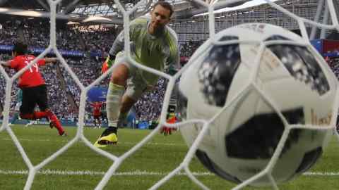 Germany goalkeeper Manuel Neuer reacts after South Korea's Kim Young-gwon, left, scored his side's opening goal during the group F match between South Korea and Germany, at the 2018 soccer World Cup in the Kazan Arena in Kazan, Russia, Wednesday, June 27, 2018. (AP Photo/Frank Augstein)