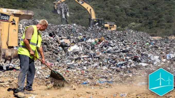 A worker and backhoe loader tractors move garbages and rubbish on a landfill site on September 1, 2015, at Propriano on the French Mediterranean island of Corsica. The island is already drowning under waste and the problem is aggravated by the influx of millions of tourists in summer. AFP PHOTO / PASCAL POCHARD-CASABIANCA TO GO WITH AFP STORY BY PIERRE LANFRANCHI (Photo credit should read PASCAL POCHARD CASABIANCA/AFP/Getty Images)