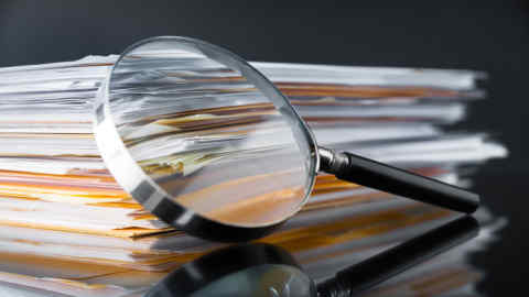 File Stack and Magnifying Glass