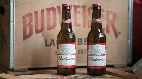 Bottles of Budweiser beer, produced by Anheuser-Busch InBev NV, sit on display following a news conference to announce the company's full year earnings in Leuven, Belgium, on Thursday, Feb. 25, 2016 AB InBev's fourth-quarter profit missed estimates as its two flagship brands both lost ground despite increased advertising and an improving U.S. beer market, underlining the need for the brewer to complete its deal for SABMiller Plc to tap new areas of growth. Photographer: Jasper Juinen/Bloomberg