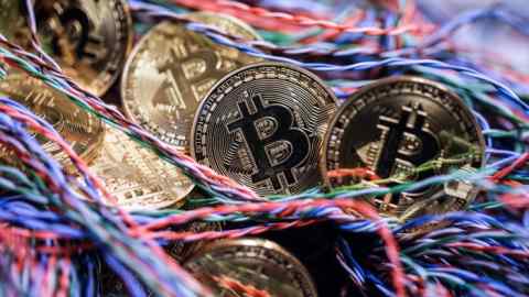 Bitcoins in an office in London, U.K. Photographer: Chris Ratcliffe/Bloomberg