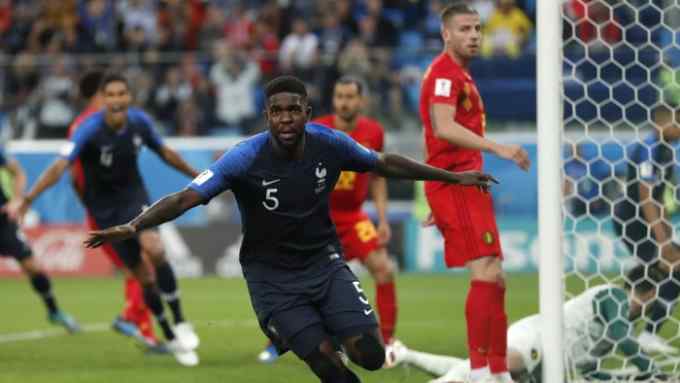France's Samuel Umtiti celebrates after scoring his sides 1st goal of the game during the semifinal match between France and Belgium at the 2018 soccer World Cup in the St. Petersburg Stadium in, St. Petersburg, Russia, Tuesday, July 10, 2018. (AP Photo/Natacha Pisarenko)