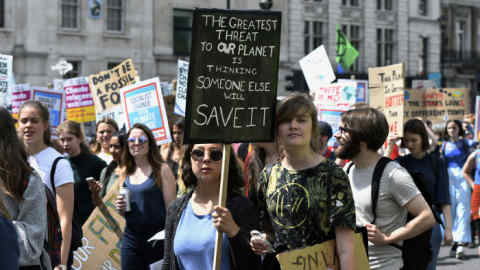 WHITEHALL, LONDON, GREATER LONDON, UNITED KINGDOM - 2019/06/21: Students hold placards at the Parliament Square during a March. Students gathered at Parliament Square and marched through central London demanding from the government and politicians direct actions to tackle the climate change. (Photo by Andres Pantoja/SOPA Images/LightRocket via Getty Images)
