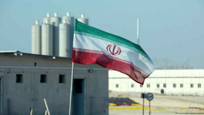 A picture taken on November 10, 2019, shows an Iranian flag in Iran's Bushehr nuclear power plant, during an official ceremony to kick-start works on a second reactor at the facility. - Bushehr is Iran's only nuclear power station and is currently running on imported fuel from Russia that is closely monitored by the UN's International Atomic Energy Agency. (Photo by ATTA KENARE / AFP) (Photo by ATTA KENARE/AFP via Getty Images)