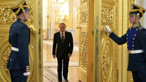 Mandatory Credit: Photo by Alexei Druzhinin/Shutterstock (5287889b) Kremlin honor guard open the golden doors for Russian President Vladimir Putin Russian President Putin meeting with Syrian President Assad, Moscow, Russia - 20 Oct 2015 Assad was in Moscow on his first trip abroad since the war broke out in Syria.