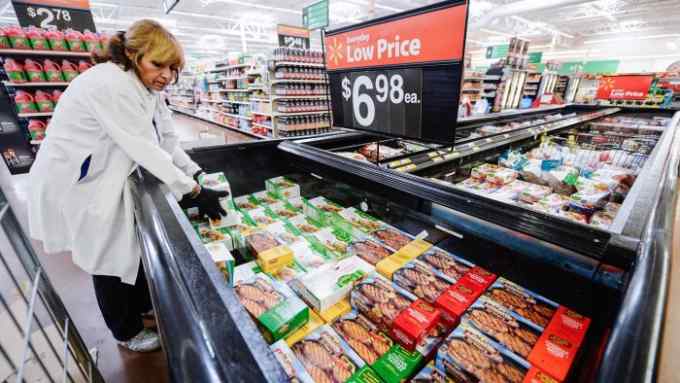 PICO RIVERA, CA - MAY 30: Employee Lucy Rodriguez stocks the frozen meat section of a Walmart Supercenter store on May 30, 2013 in Pico Rivera, California. Walmart is the largest private employer in the United State employing 13,000 employees in Los Angeles County and 75,000 in the state of California. (Photo by Kevork Djansezian/Getty Images)
