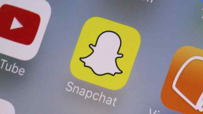 This Wednesday, Aug. 9, 2017, photo shows the Snapchat app on a mobile device in New York. Snap Inc. reports earnings Tuesday, Feb. 6, 2018. (AP Photo/Richard Drew)