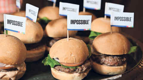 The Impossible Burger 2.0, the new and improved version of the company's plant-based vegan burger that tastes like real beef is introduced at a press event during CES 2019 in Las Vegas, Nevada on January 7, 2019. - The updated version can be cooked on a grill and has a better flavor and lowered cholesterol, fat and calories than the original. &quot;Unlike the cow, we get better at making meat every single day,&quot; CEO of Impossible Foods CEO Pat Brown. (Photo by Robyn Beck / AFP) (Photo credit should read ROBYN BECK/AFP/Getty Images)